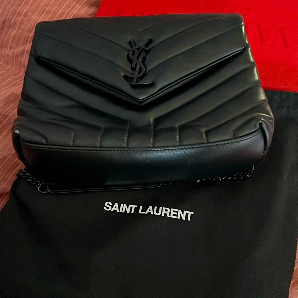 Slighty used; small scuff on the small corner of bag not noticeable;
